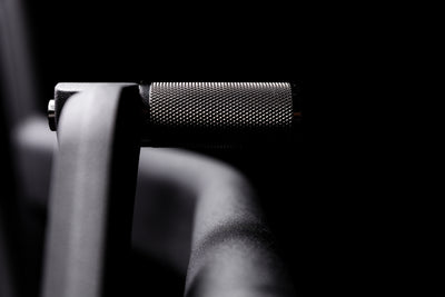 Close-up shot of the knurling on the resistance mode handle on the Strive Curved Treadmill