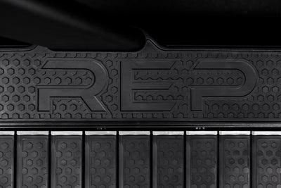The REP Fitness branding on the sides of the Strive Curved Treadmill deck