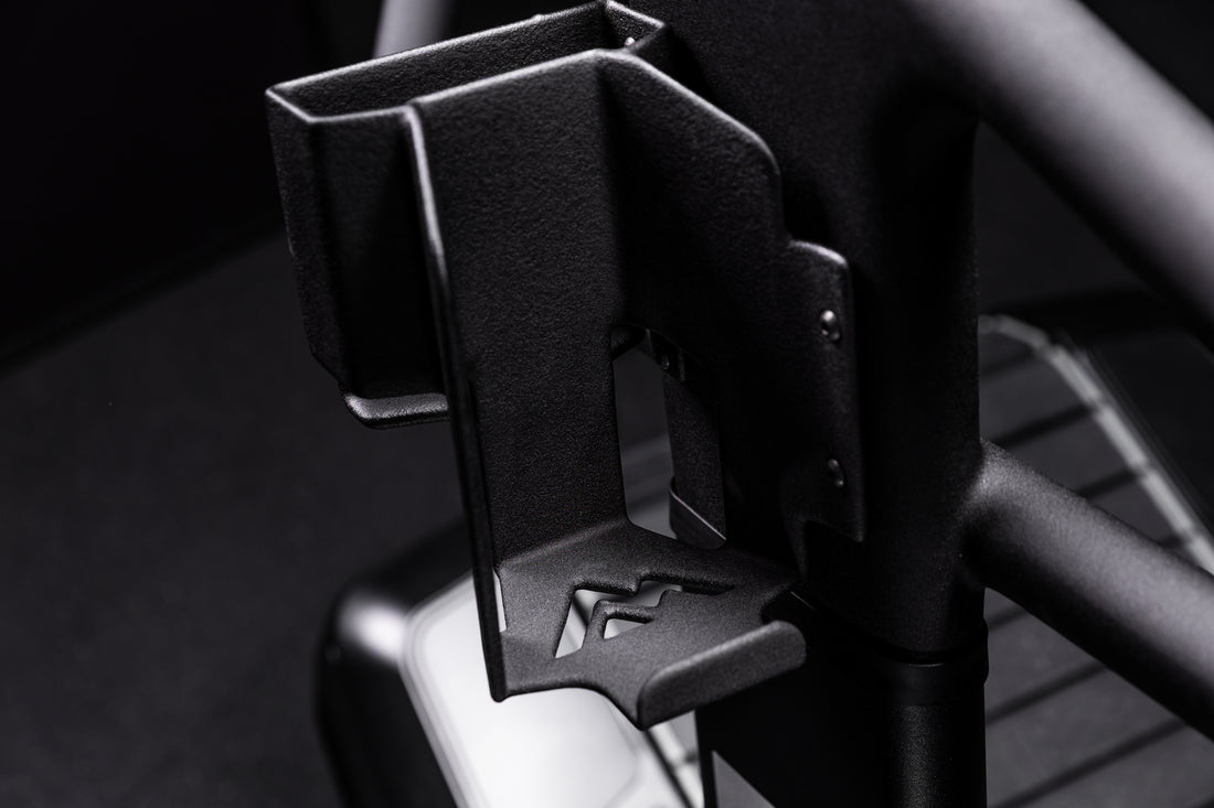 Close-up shot of the water bottle and phone holder on the Strive Curved Treadmill