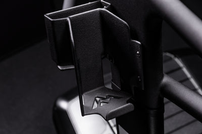 Close-up shot of the water bottle and phone holder on the Strive Curved Treadmill