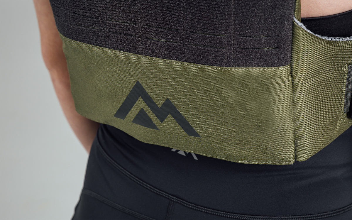 Mountain logo on the back bottom of the Strata Weight Vest