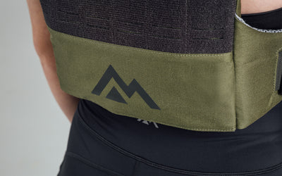 Mountain logo on the back bottom of the Strata Weight Vest