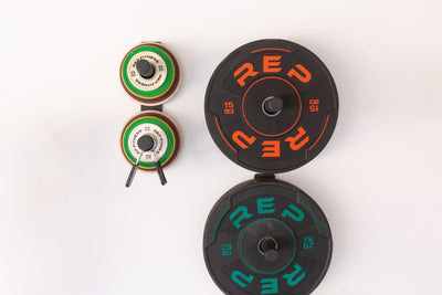 Single and double Wall Mounted Plate Storage loaded with bumper plates and change plates.